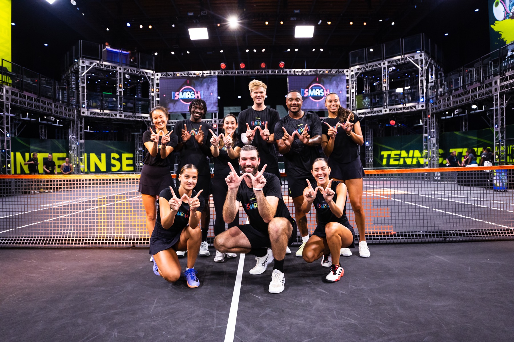 An INTENNSE team gathered together on court before play, in matching kit.